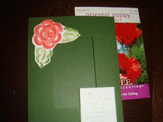 Green seed packet favor decorated with a pink flower